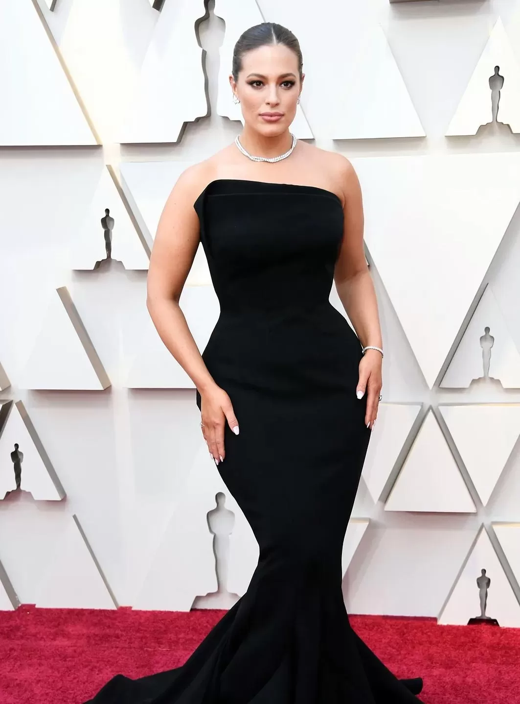 ashley-graham Ashley Graham in black hourglass dress at the Oscars red carpet